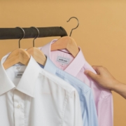 white button up shirt on brown clothes hanger