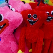 Close up photo of pink and red stuffed toys