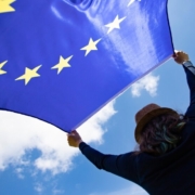 bigstock-young-woman-holding-european-u-302766865-990x556