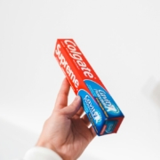 a-person-holding-colgate-toothpaste-box-stockpack-pexels.jpg A person holding colgate toothpaste box