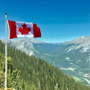 canada-flag-with-mountain-range-view-stockpack-pexels.jpg Canada flag with mountain range view
