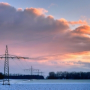 field, high voltage pylons, overhead lines