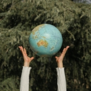 person-tossing-a-globe-stockpack-pexels.jpg Person tossing a globe