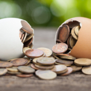 Coin,In,Egg,Cracked,On,Wooden,Natural,Background,,Financial,Concept