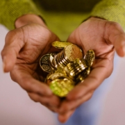 Gold coins in person s hands