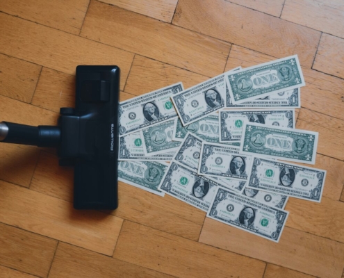 a-pile-of-money-sitting-on-top-of-a-wooden-floor-stockpack-unsplash.jpg a pile of money sitting on top of a wooden floor