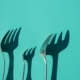 three-gray-metal-forks-casting-shadow-on-green-surface-stockpack-unsplash.jpg three gray metal forks casting shadow on green surface