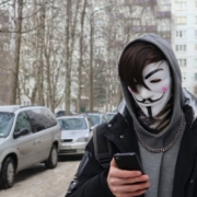 a-person-wearing-a-mask-and-holding-a-cell-phone-stockpack-unsplash.jpg