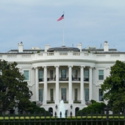 white-concrete-building-with-flags-on-top-stockpack-pexels.jpg White concrete building with flags on top