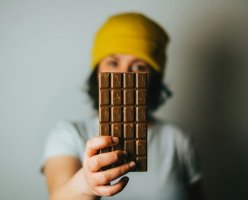 girl-holding-chocolate-bar-stockpack-unsplash.jpg Girl holding chocolate bar