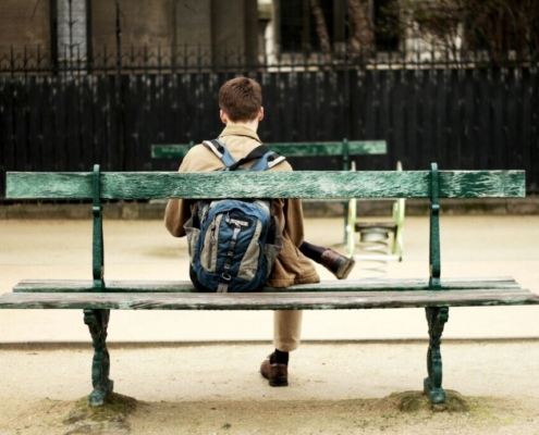 person-sitting-on-a-bench-stockpack-unsplash.jpg Person sitting on a bench