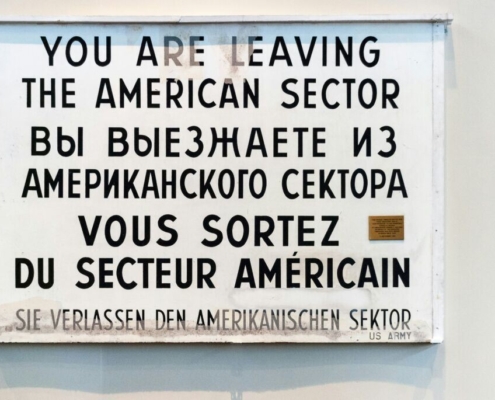 »You are leaving the american sector«. Berlin sign at Checkpoint Charlie before the fall of the wall in 1989.