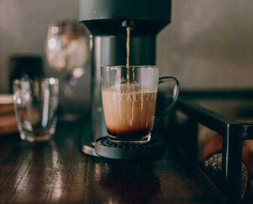 a-coffee-maker-is-on-a-table-with-a-cup-of-coffee-stockpack-pexels.jpg A coffee maker is on a table with a cup of coffee