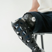 Close up shot of a person sitting on a metal chair