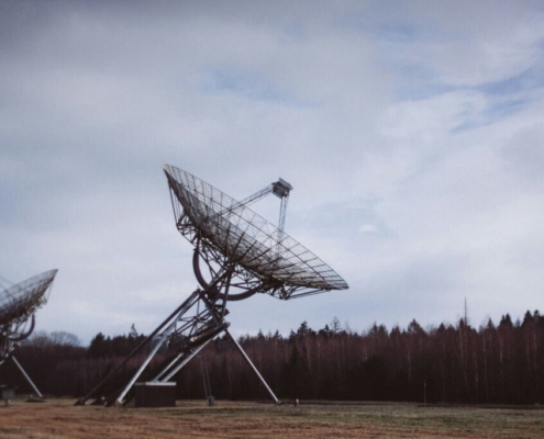 gray-satellite-dish-on-green-grass-field-under-white-clouds-during-daytime-stockpack-unsplash.jpg