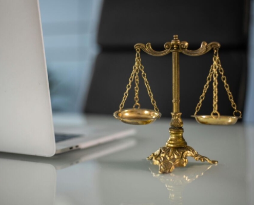 a-golden-balance-scale-beside-a-laptop-stockpack-pexels.jpg A golden balance scale beside a laptop