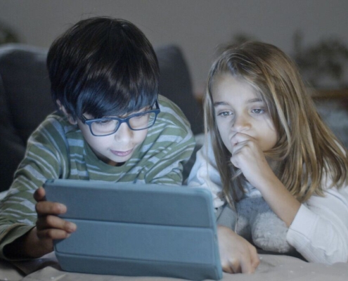 Kids looking at a tablet