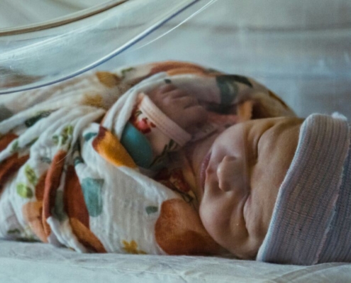 a-baby-in-a-crib-stockpack-unsplash.jpg