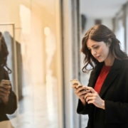 close-up-photo-of-woman-in-black-coat-using-smartphone-stockpack-pexels.jpg Close up photo of woman in black coat using smartphone