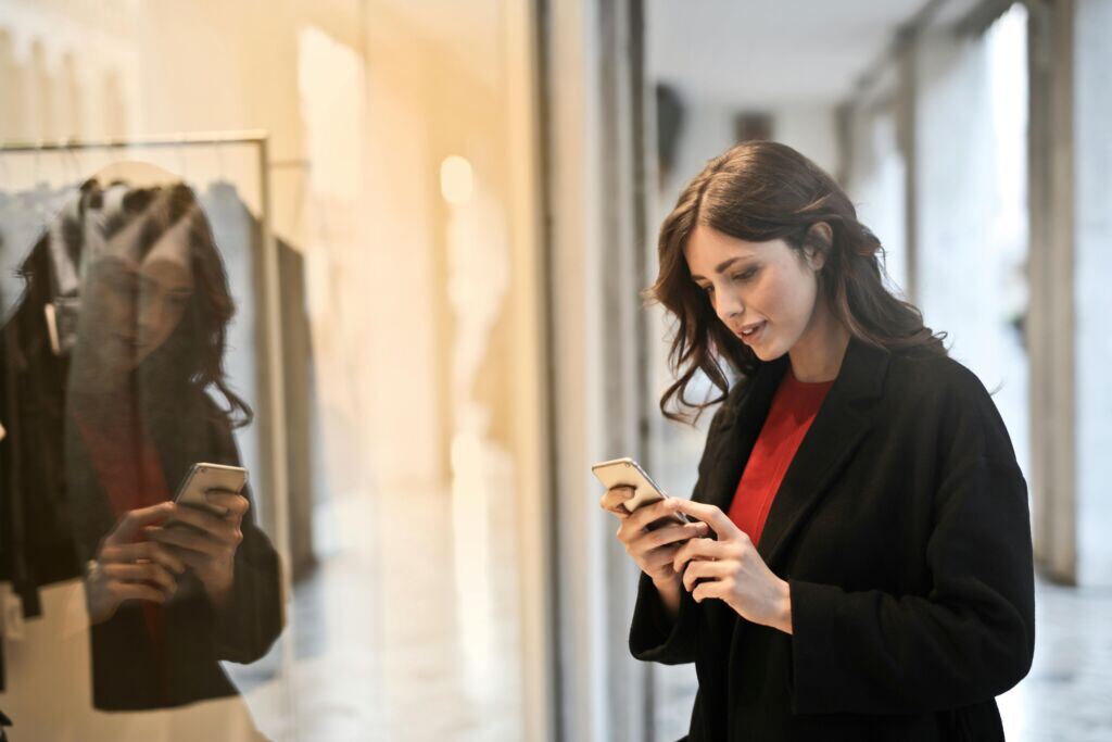 close-up-photo-of-woman-in-black-coat-using-smartphone-stockpack-pexels.jpg Close up photo of woman in black coat using smartphone