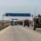 Moving vehicles on the road under blue sky
