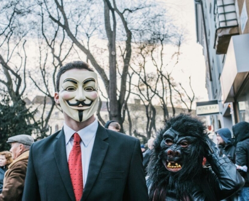 man-in-black-suit-jacket-wearing-black-and-white-mask-stockpack-unsplash.jpg