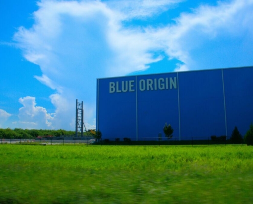 a-large-blue-building-with-a-sign-on-it-stockpack-unsplash.jpg