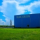 a-large-blue-building-with-a-sign-on-it-stockpack-unsplash.jpg