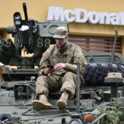 man-in-brown-camouflage-sitting-on-top-of-tank-stockpack-pexels.jpg Man in brown camouflage sitting on top of tank