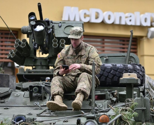 man-in-brown-camouflage-sitting-on-top-of-tank-stockpack-pexels.jpg Man in brown camouflage sitting on top of tank