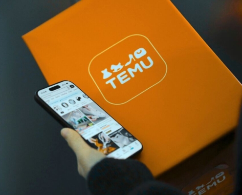 A Temu parcel/box with a phone