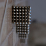 silver-beads-on-brown-wooden-table-stockpack-unsplash.jpg