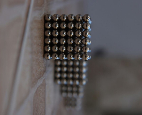 silver-beads-on-brown-wooden-table-stockpack-unsplash.jpg