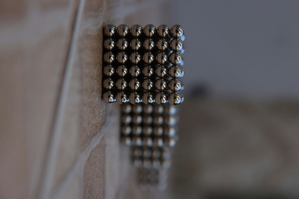 silver-beads-on-brown-wooden-table-stockpack-unsplash.jpg