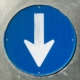 a-close-up-of-a-blue-sign-with-a-white-arrow-stockpack-unsplash.jpg