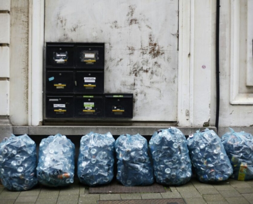 a-bunch-of-bags-sitting-on-the-side-of-a-building-stockpack-unsplash.jpg