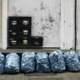 a-bunch-of-bags-sitting-on-the-side-of-a-building-stockpack-unsplash.jpg
