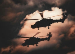 Dramatic silhouette of helicopters in flight