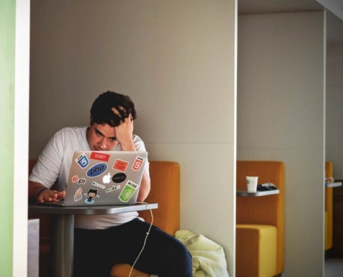 man, boy, laptop, cafe, frustrated, frustration, yound, expression, emotions, alone, booth, table, brown computer, brown laptop, brown alone, brown table, brown cafe, frustrated, frustrated, frustrated, frustrated, frustrated, frustration, frustration, frustration