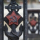 Rusty soviet anchor with hammer and sickle symbol