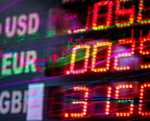 A close up shot of numbers and stock charts