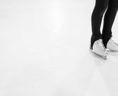 a-person-in-black-leggings-wearing-a-dirty-ice-skates-stockpack-pexels.jpg A person in black leggings wearing a dirty ice skates