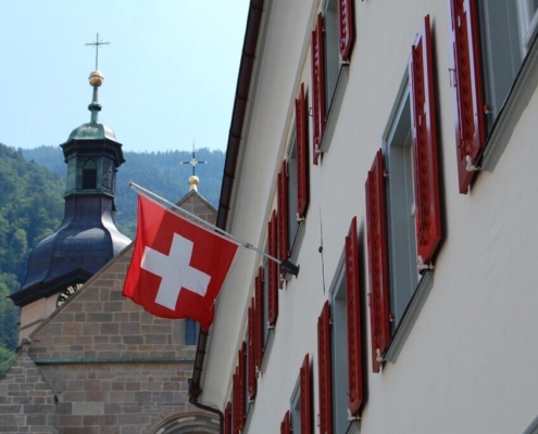 switzerland, church tower, shutters, flag