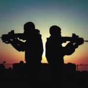 silhouette-of-men-holding-guns-stockpack-pexels.jpg Silhouette of men holding guns