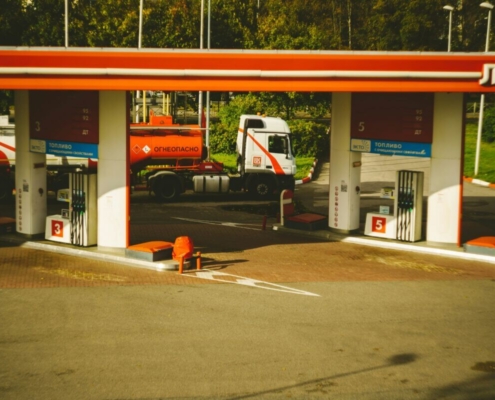 a-couple-of-trucks-are-parked-at-a-gas-station-stockpack-unsplash.jpg