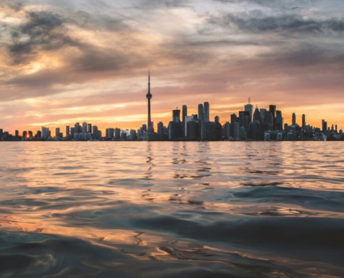 the-toronto-skyline-with-the-cn-tower-across-lake-ontario-at-golden-hour-stockpack-unsplash.jpg