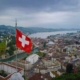 aerial-shot-of-swizz-flag-waving-over-lucerne-stockpack-pexels.jpg Aerial shot of swizz flag waving over lucerne