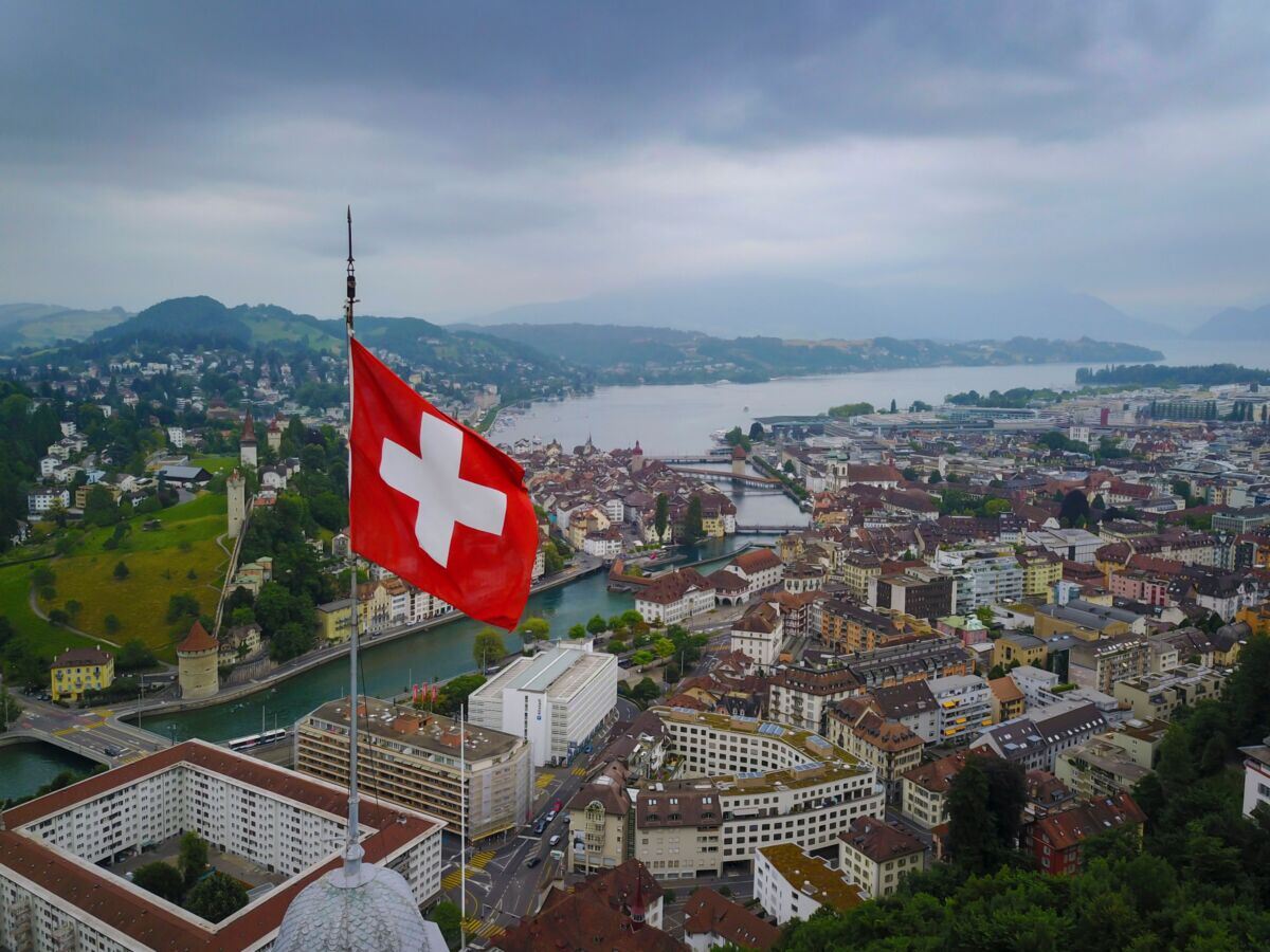 aerial-shot-of-swizz-flag-waving-over-lucerne-stockpack-pexels.jpg Aerial shot of swizz flag waving over lucerne